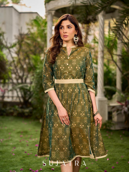 Statement olive green two-tone Ikat dress elevated with cream and gold accents, a structured belt for definition, and a subtle left-front slit.