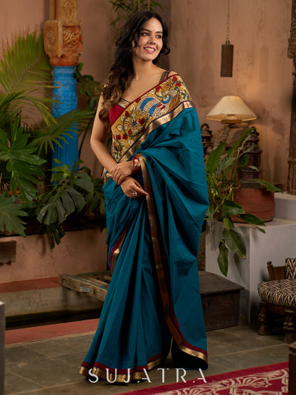 Teal cotton saree with Kalamkari border and rich khun border detailing