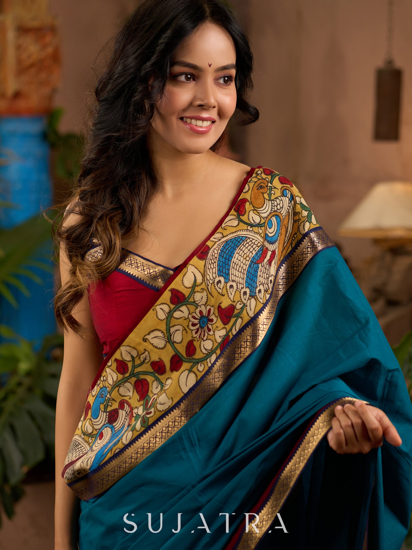 Teal cotton saree with Kalamkari border and rich khun border detailing