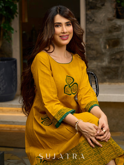 Contemporary Mustard Floral Hand Block Print Dress featuring Front & Back Box Pleat with Geometric Border on Hem & Sleeves