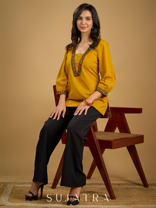Elegant handcrafted mirror work mustard cotton top.