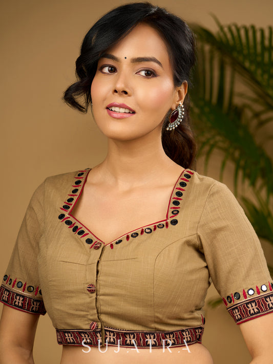 Exquisite hand embroidered dark beige ajrakh combination cotton blouse.