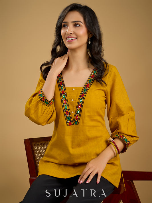 Elegant handcrafted mirror work mustard cotton top.