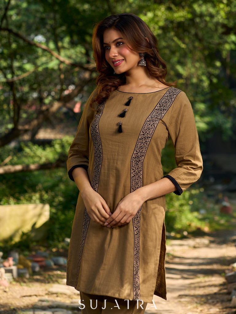 Minimal Sand Beige short kurta with a striking black Ajrakh border.