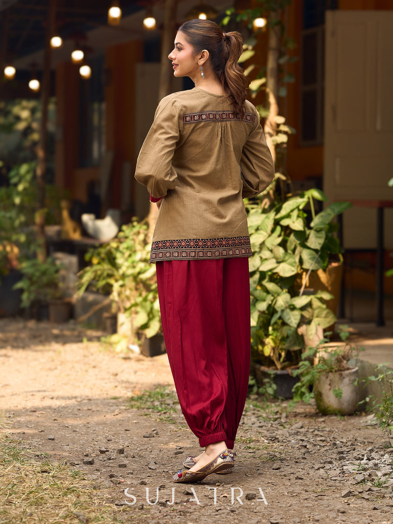 Beige Cotton Top Featuring Ajrakh Border, V Neckline, Gathered Sleeves And Fabric Tassels