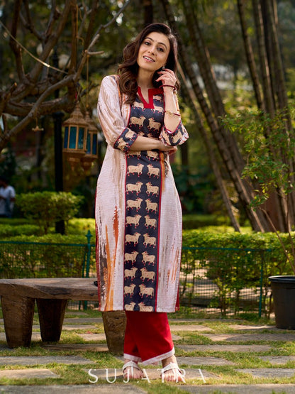 Artisanal off-white kurta showcasing Pichwai-inspired cow artwork highlighted with classic red tones