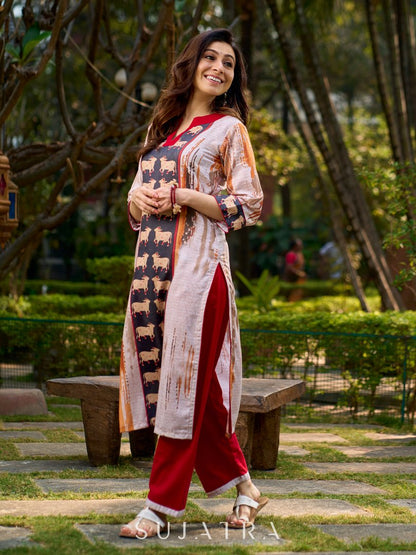 Artisanal off-white kurta showcasing Pichwai-inspired cow artwork highlighted with classic red tones