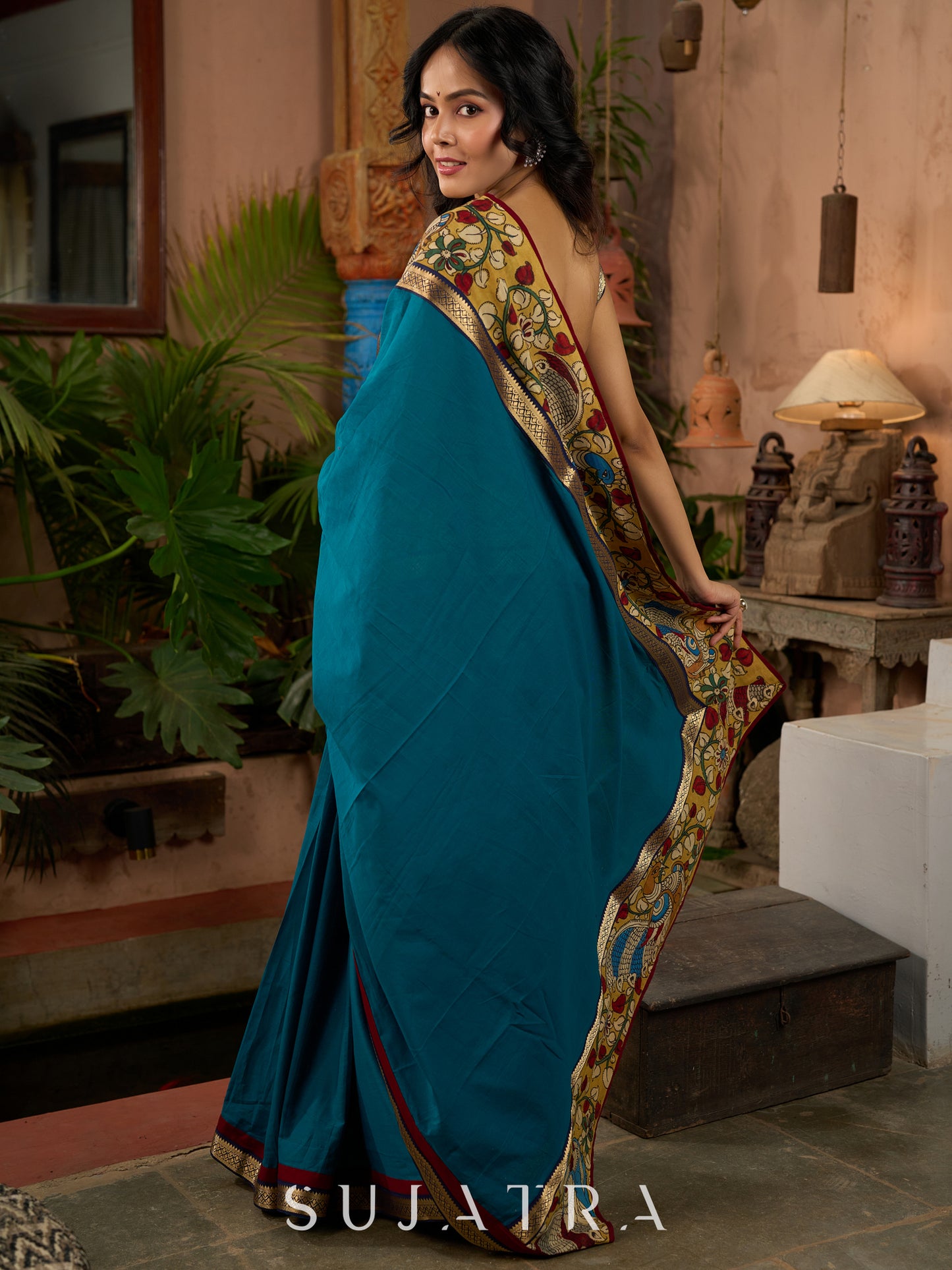 Teal cotton saree with Kalamkari border and rich khun border detailing