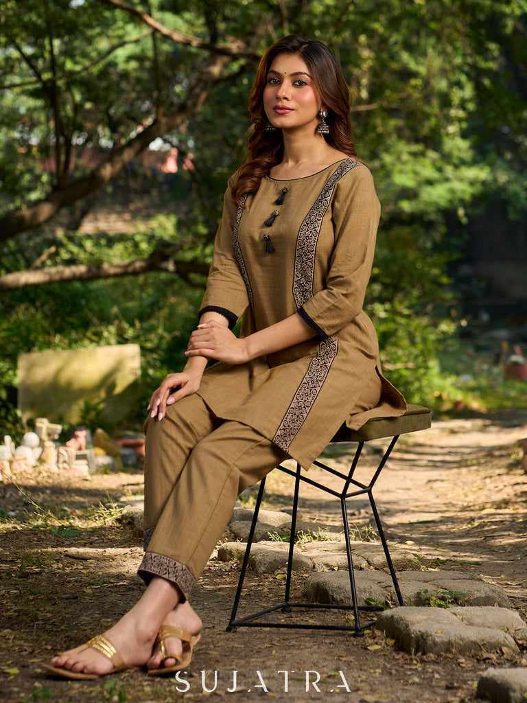 Minimal Sand Beige short kurta with a striking black Ajrakh border.