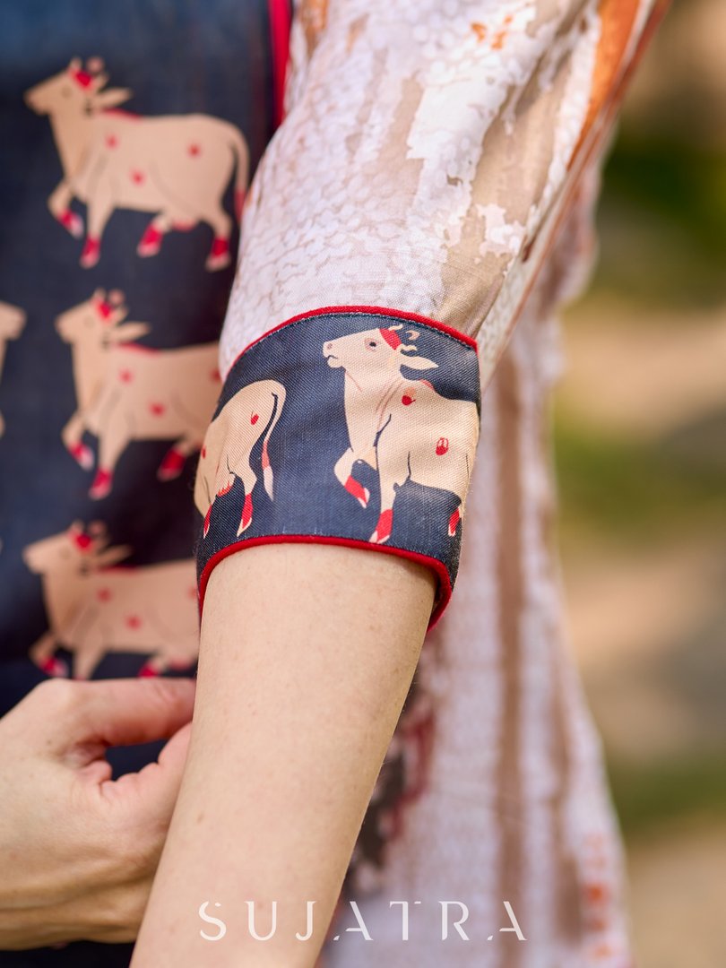Dussehra Sale — Artisanal off-white kurta showcasing Pichwai-inspired cow artwork highlighted with classic red tones - Pant Optional