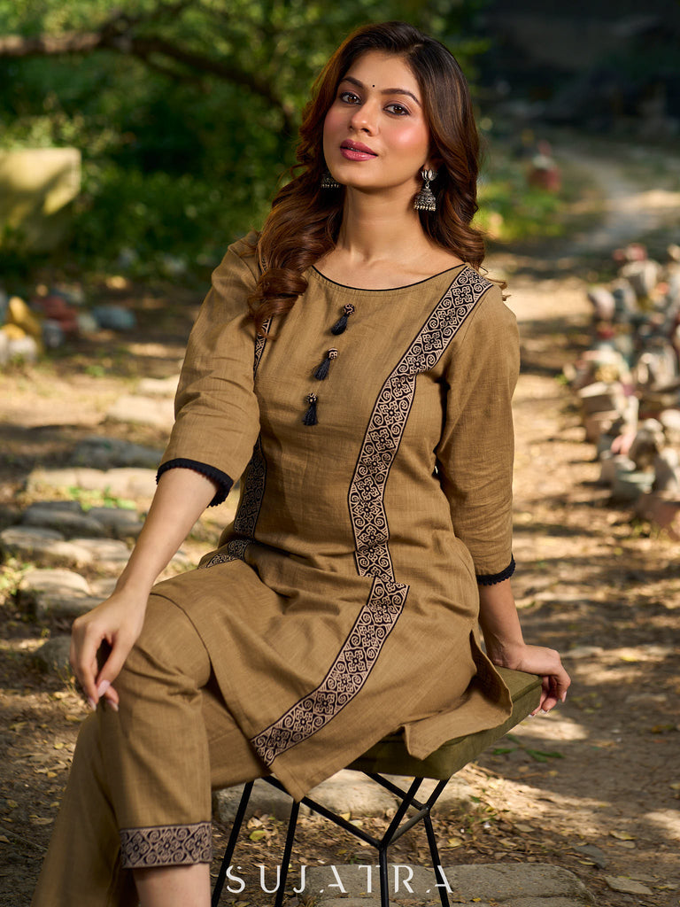 Minimal Sand Beige short kurta with a striking black Ajrakh border.