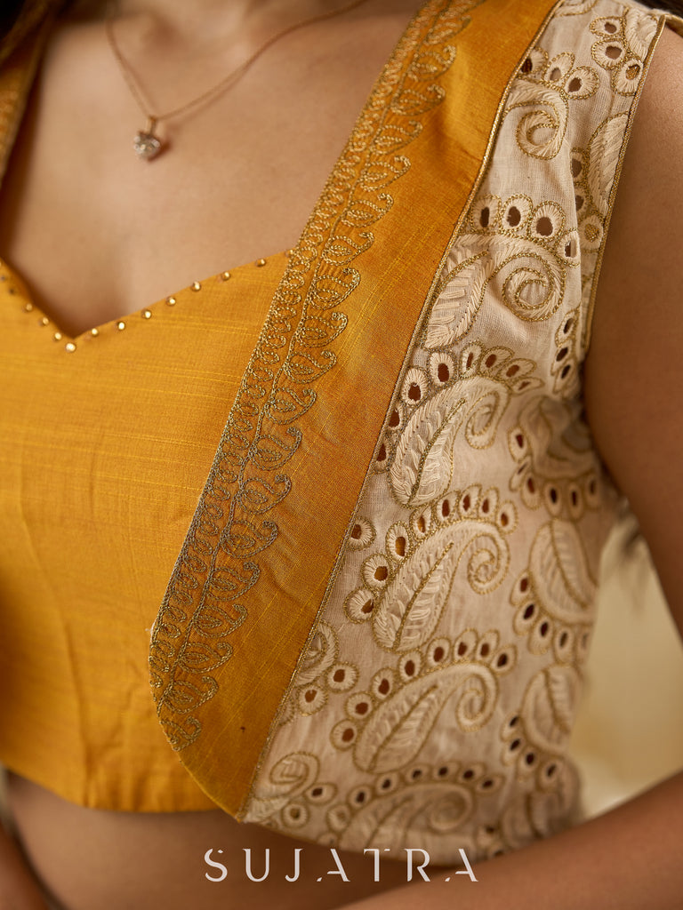 A chic off-white Hakoba Lehenga with intricate gold embroidery accented by a bold, saffron yellow blouse - Gold embroidered hakoba Shrug Optional