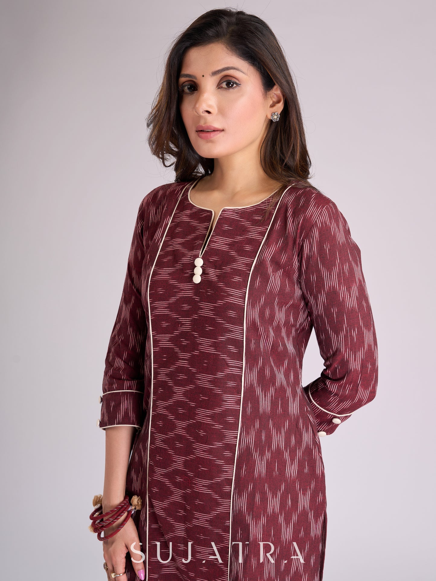 Sophisticated Maroon Ikat Cotton Kurta with Contrasting White Piping Accents