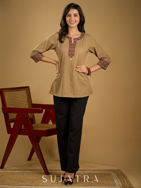 Ethnic dark beige cotton top highlighted with elegant ajrakh detail.