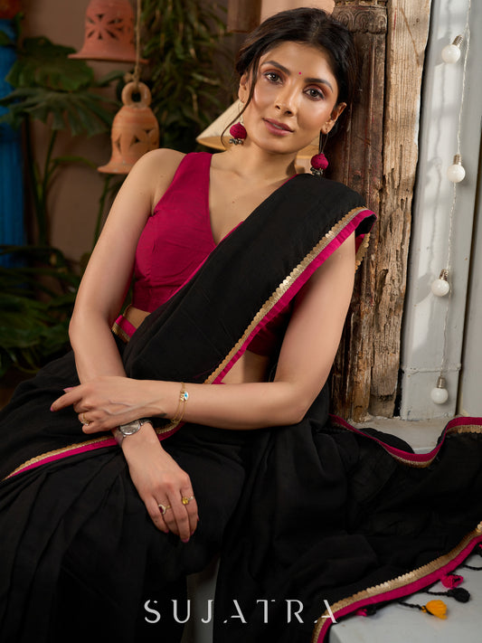 Pure black cotton saree with zari border & pom poms
