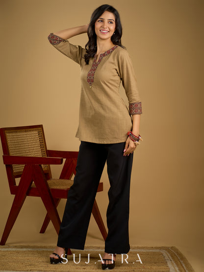 Ethnic dark beige cotton top highlighted with elegant ajrakh detail.