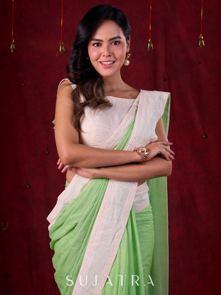 Soft Pastel Green Mul Cotton Saree Adorned with Delicate Hakoba Border & Pallu