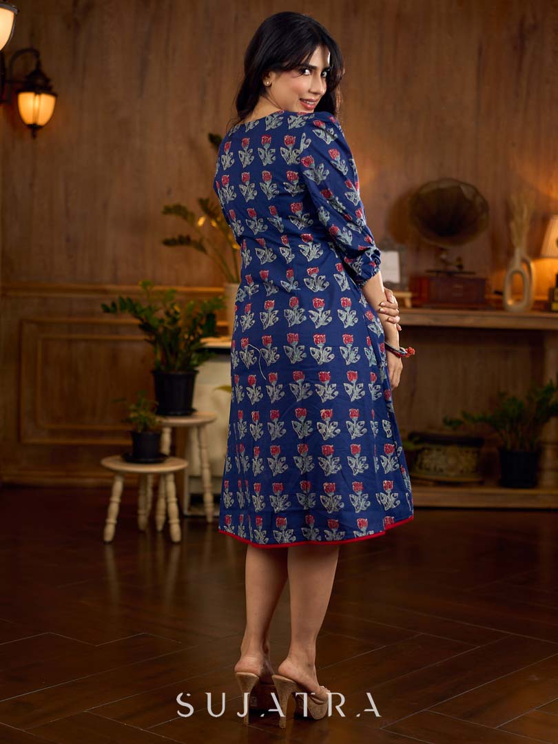 Royal blue Jaipur-printed dress featuring red rose motifs, a pintuck neck patch with red accents, and balloon 3/4th sleeves, creating a graceful silhouette with a blend of artisanal charm and contemporary elegance.