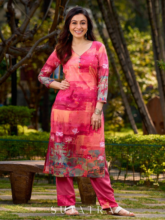 Graceful pink-shaded kurta featuring abstract Pichwai lotus–inspired motifs and a delicate neckline