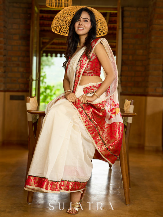 Heritage white Chanderi saree with benarasi border featuring artisanal hand-painted floral motifs