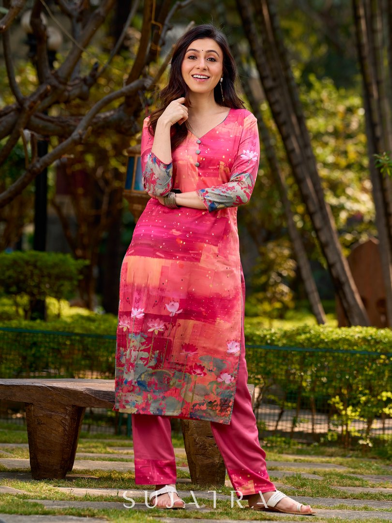 Graceful pink-shaded kurta featuring abstract Pichwai lotus–inspired motifs and a delicate neckline
