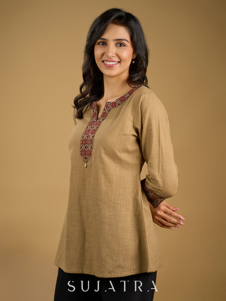 Ethnic dark beige cotton top highlighted with elegant ajrakh detail.