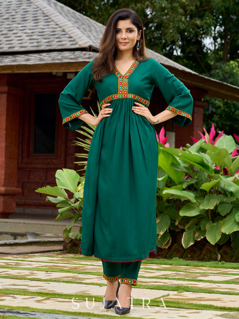 Beautiful Kutch mirror embroidery enriches this flared green rayon kurta - pant optional