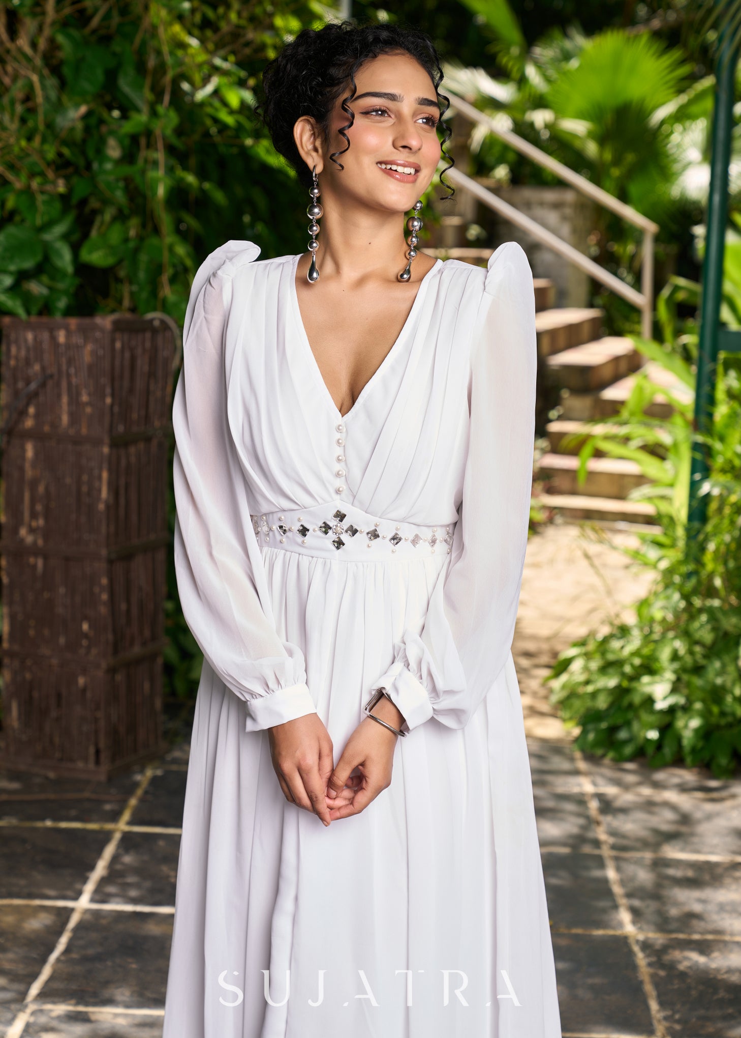 Elegant white georgette long flowy dress highlighted with beautiful pe Sujatra Elegant white georgette long flowy dress highlighted with beautiful pe Sujatra