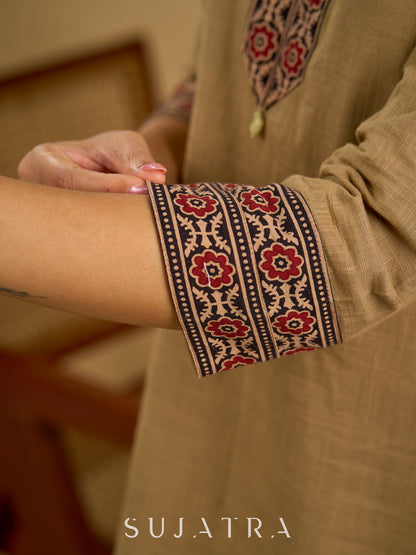 Ethnic dark beige cotton top highlighted with elegant ajrakh detail.