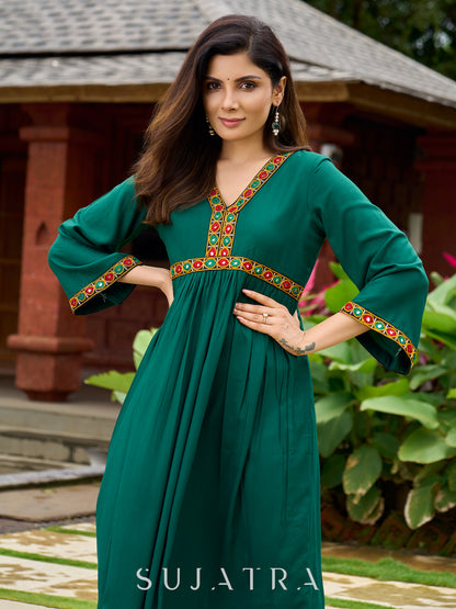 Beautiful Kutch mirror embroidery enriches this flared green rayon kurta - pant optional