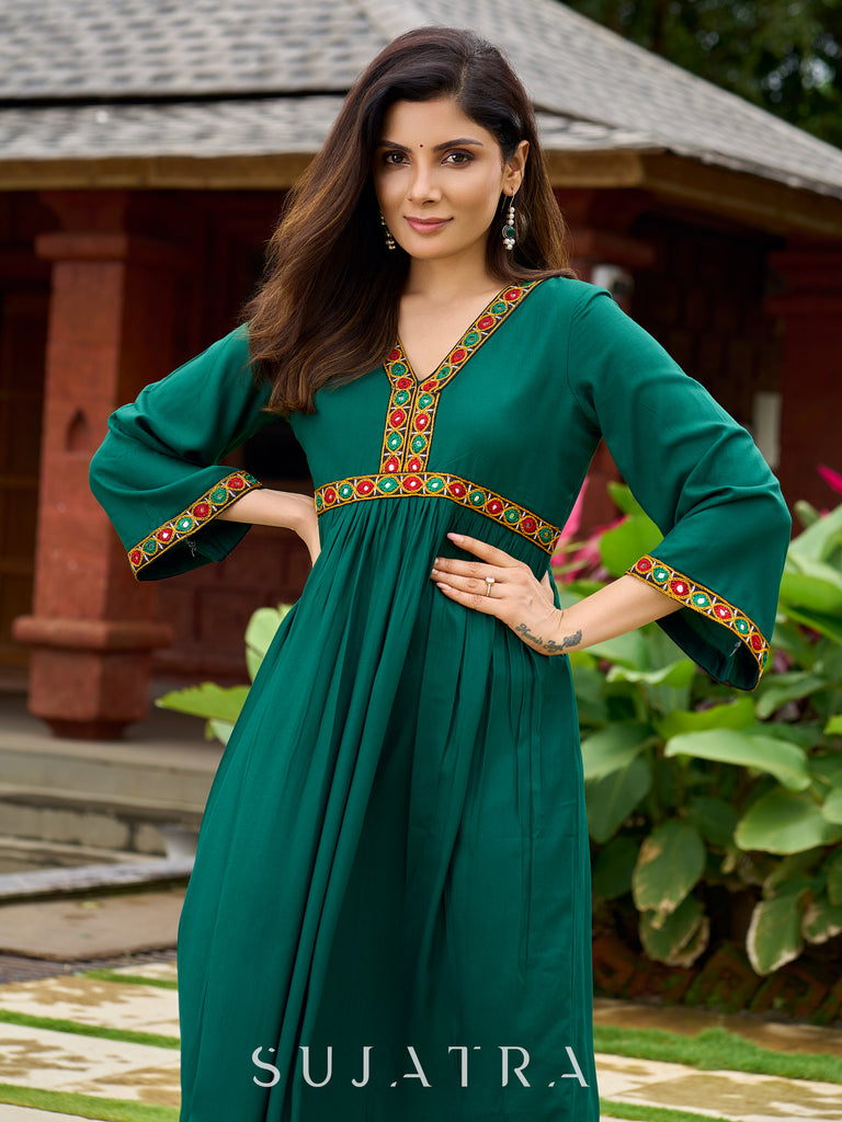 Beautiful Kutch mirror embroidery enriches this flared green rayon kurta - pant optional
