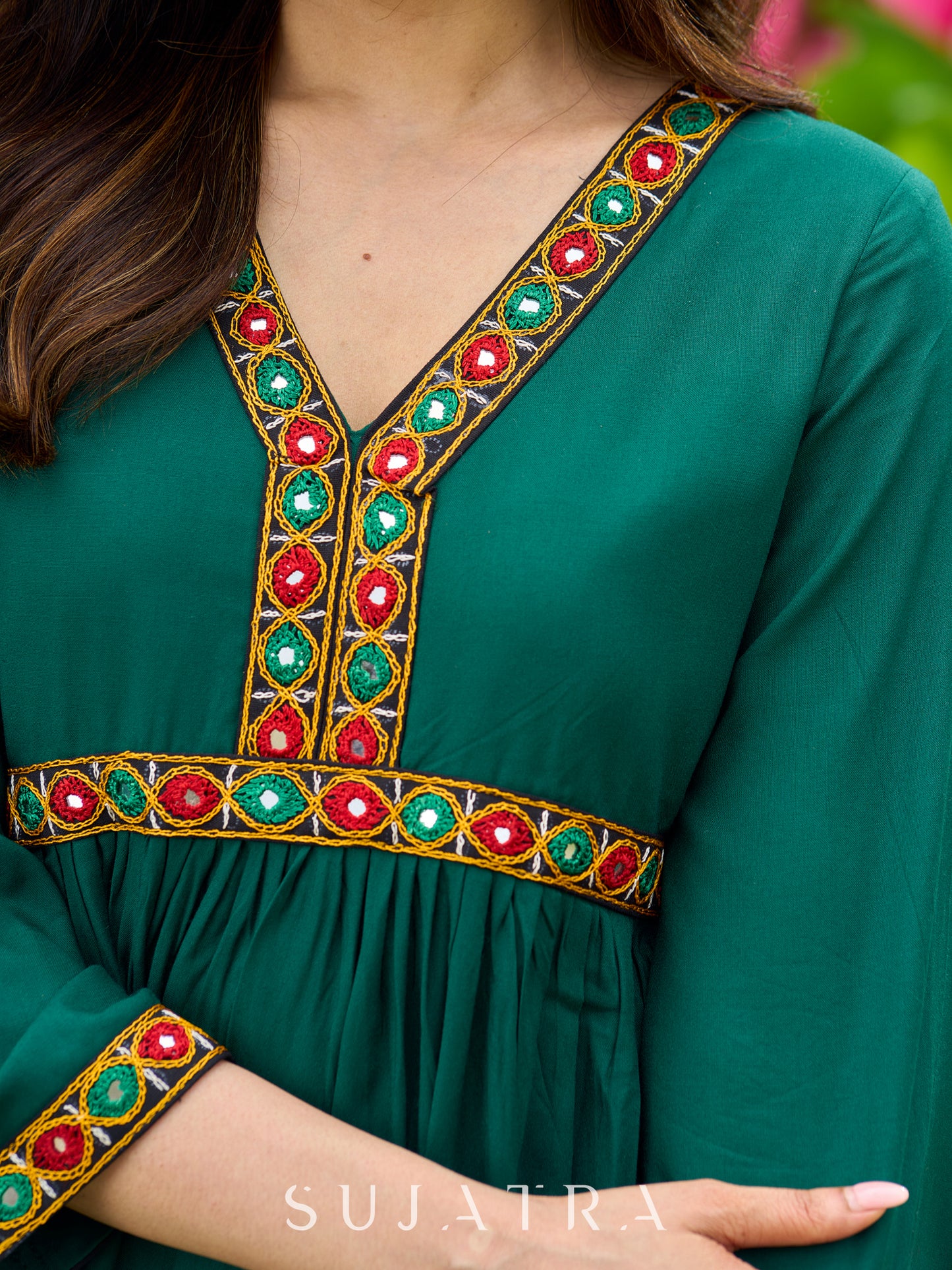 Beautiful Kutch mirror embroidery enriches this flared green rayon kurta - pant optional