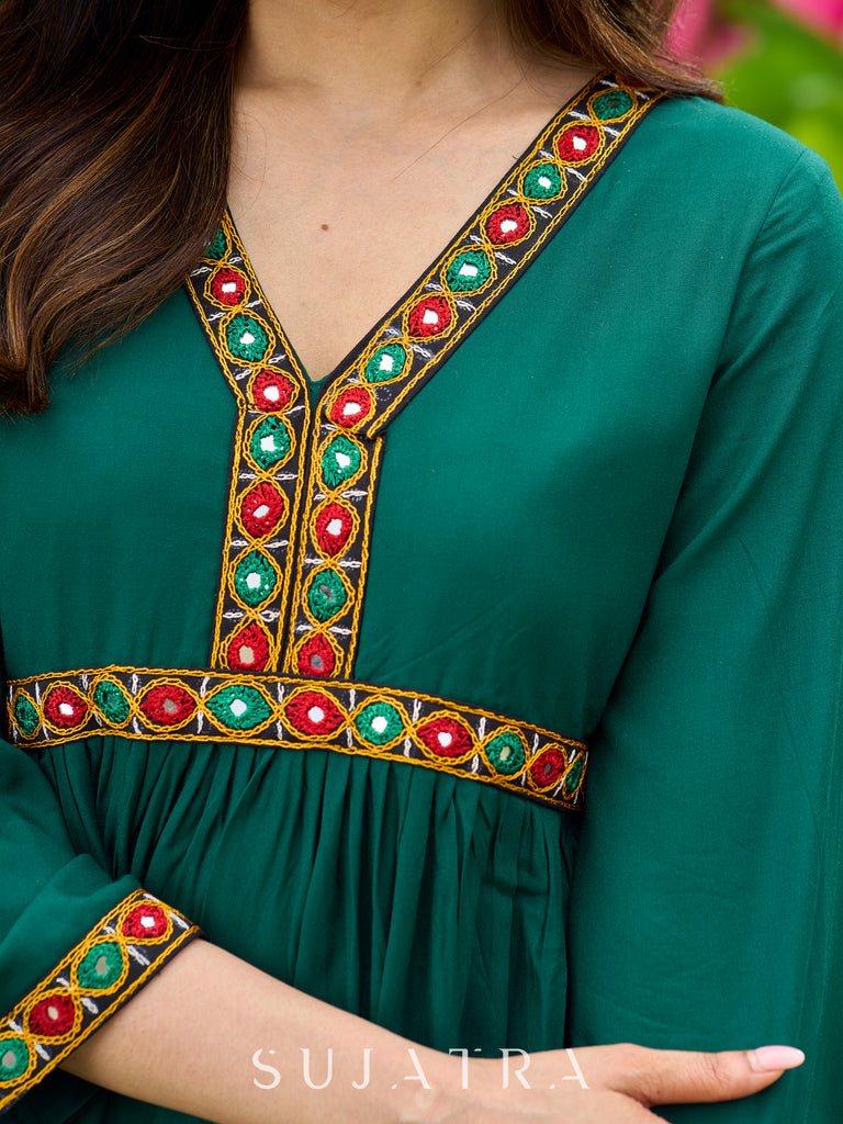 Beautiful Kutch mirror embroidery enriches this flared green rayon kurta - pant optional