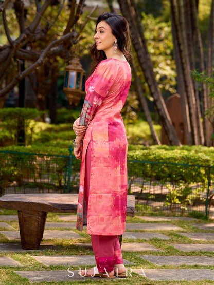Graceful pink-shaded kurta featuring abstract Pichwai lotus–inspired motifs and a delicate neckline