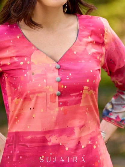 Graceful pink-shaded kurta featuring abstract Pichwai lotus–inspired motifs and a delicate neckline
