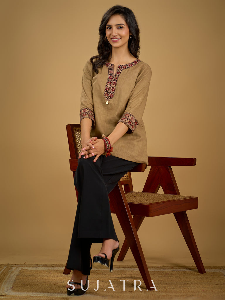 Ethnic dark beige cotton top highlighted with elegant ajrakh detail.