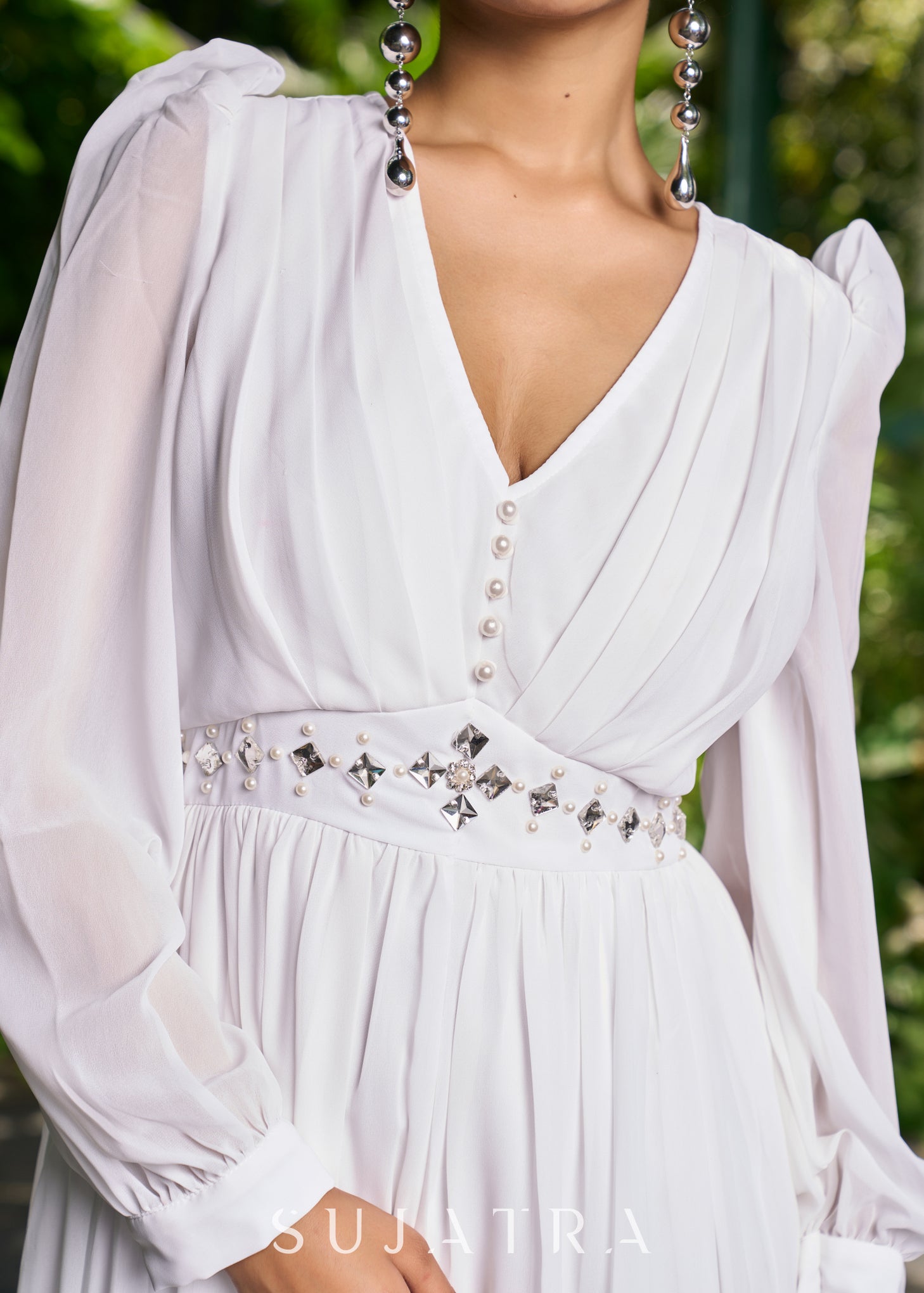 Elegant white georgette long flowy dress highlighted with beautiful pe Sujatra Elegant white georgette long flowy dress highlighted with beautiful pe Sujatra
