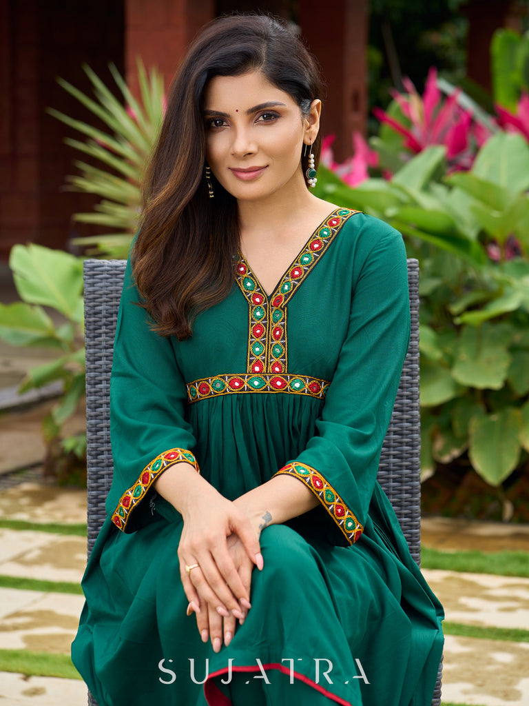 Beautiful Kutch mirror embroidery enriches this flared green rayon kurta - pant optional