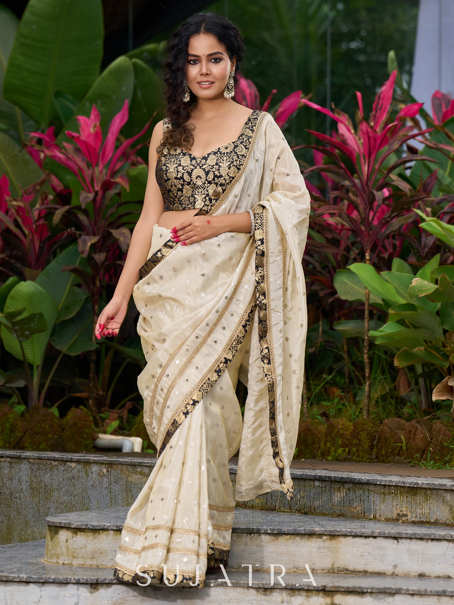 Timeless ivory tissue saree featuring zari embroidery and Banarasi accents