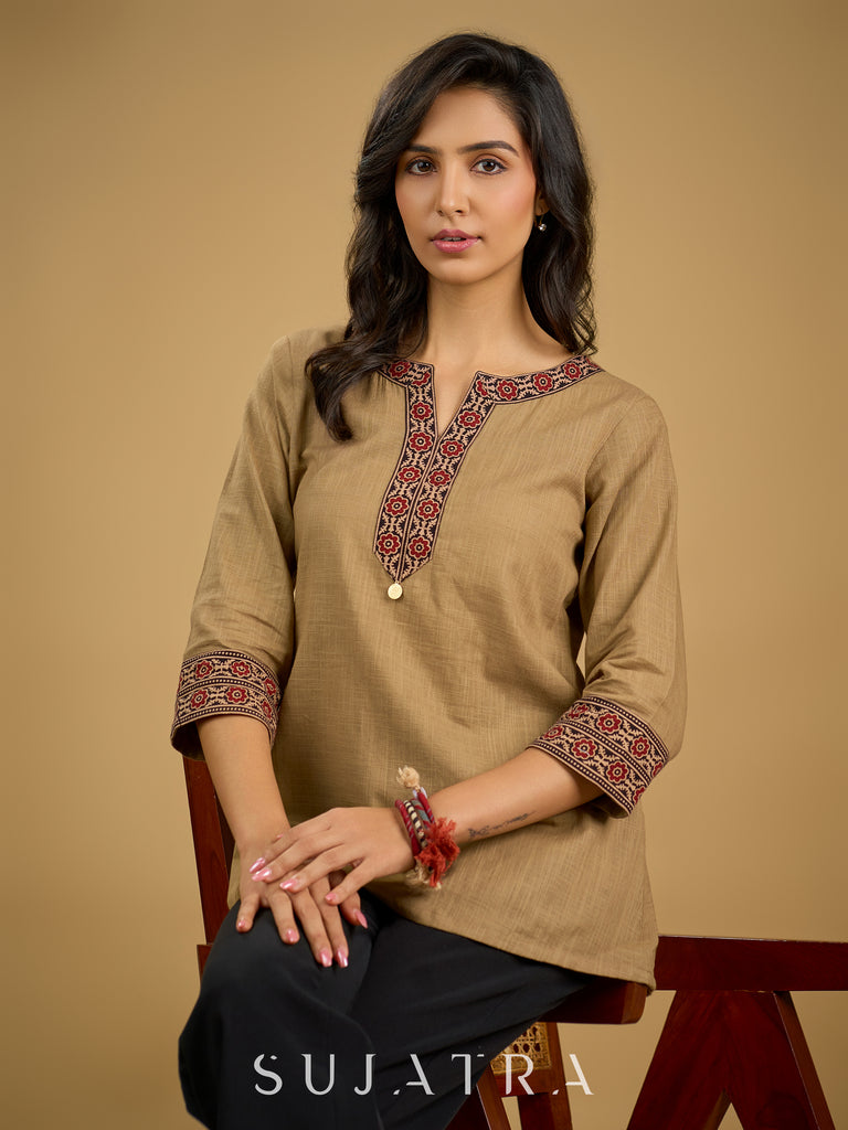 Ethnic dark beige cotton top highlighted with elegant ajrakh detail.