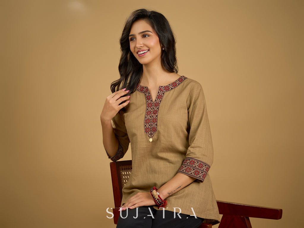 Ethnic dark beige cotton top highlighted with elegant ajrakh detail.