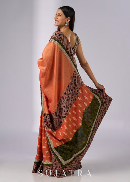 Exclusive orange cotton saree with multi Ajrakh border