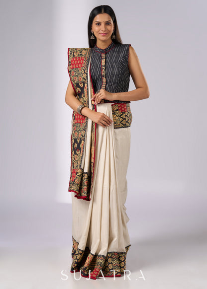 Stylish off white cotton saree with patch work prints & hand painted motifs