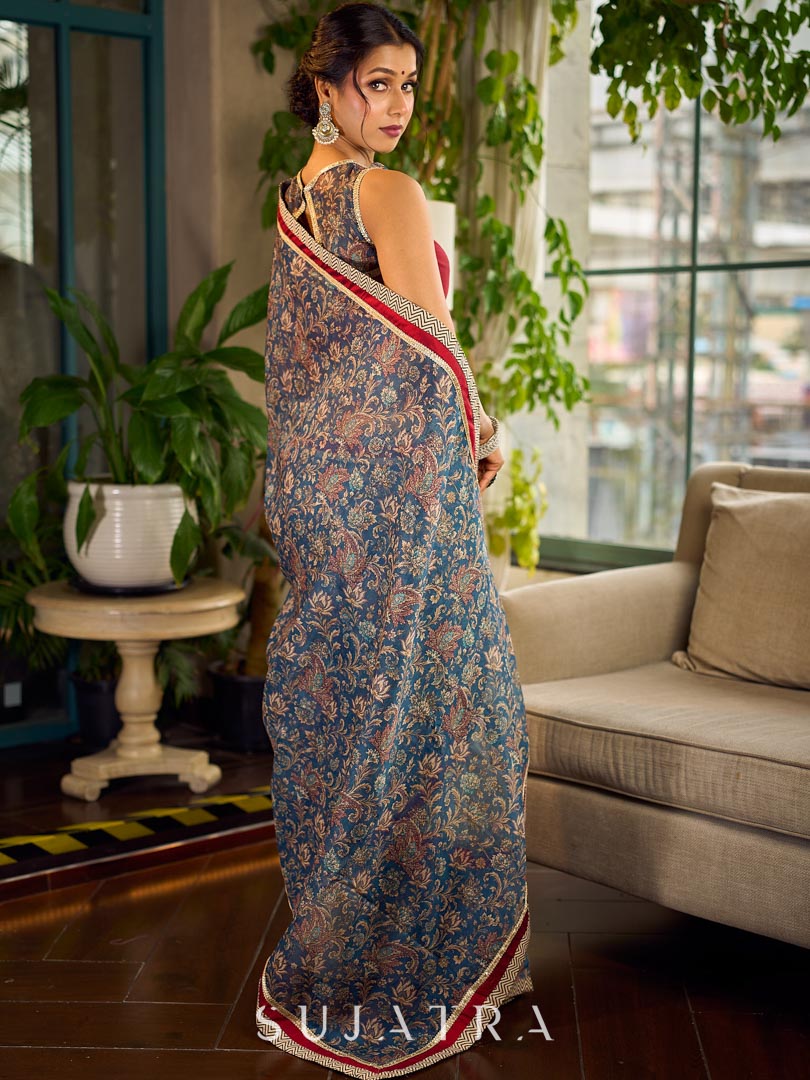 Flourishing Ivory Kalamkari Floral Chanderi Saree with Red Zari-Trimmed Hem & Chevron Border Accent