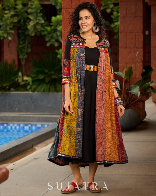 Black Rayon Double-Flared Sleeveless Dress with Mirror Work Embellishments  -  Patchwork Ajrakh Jacket Additional