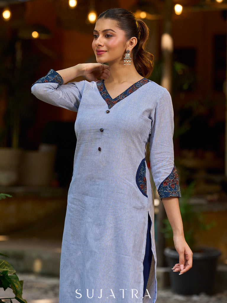 chic blue striped kurta adorned with peeking ajrakh accents on the pocket and sleeves.