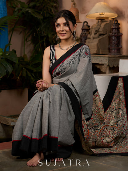 Sophisticated grey cotton saree with bold Madhubani artistry and timeless allure