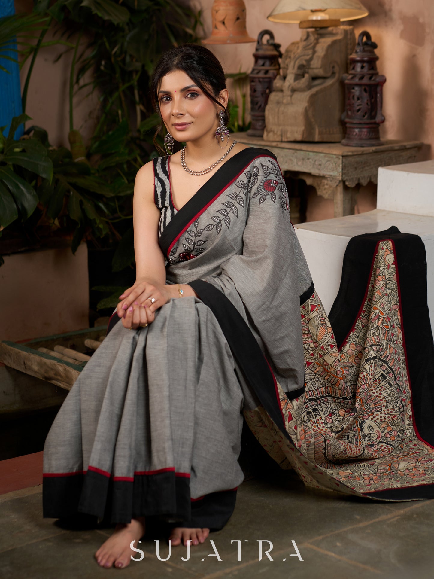 Sophisticated grey cotton saree with bold Madhubani artistry and timeless allure