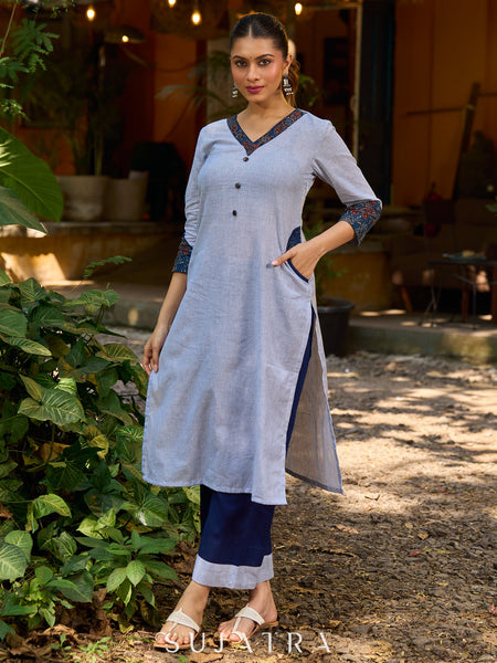 chic blue striped kurta adorned with peeking ajrakh accents on the pocket and sleeves.