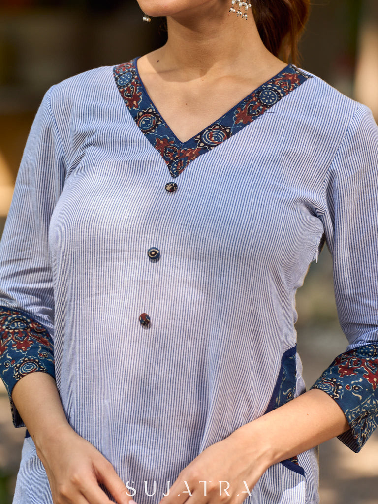 chic blue striped kurta adorned with peeking ajrakh accents on the pocket and sleeves.